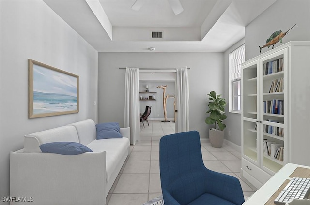 2000 Royal Marco Way Unit 607, Marco Island, FL 34145 - living room with light tile patterned flooring, a tray ceiling, and baseboards