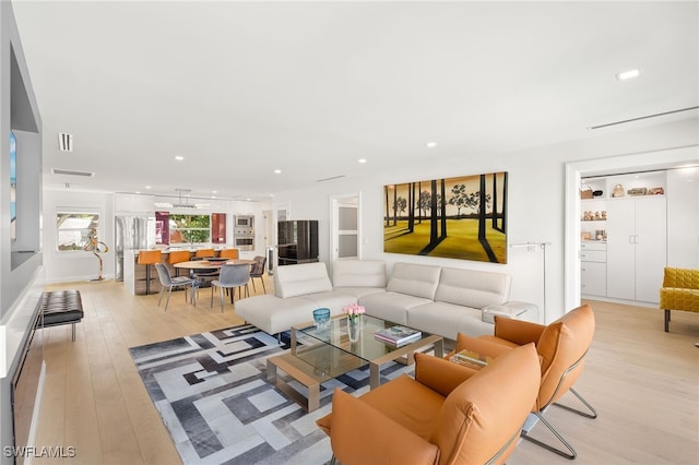 360 10th Ave S Unit B200, Naples, FL 34102 - living room featuring light wood-style floors, recessed lighting, and visible vents