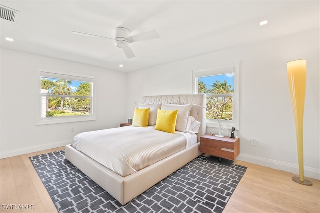 360 10th Ave S Unit B200, Naples, FL 34102 - bedroom featuring visible vents, light wood-style floors, baseboards, and multiple windows