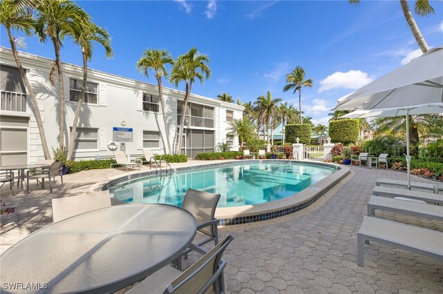 360 10th Ave S Unit B200, Naples, FL 34102 - pool featuring outdoor dining area and a patio area