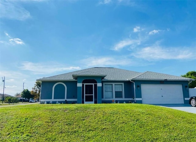 ranch-style house featuring an attached garage, stucco siding, a front yard, and concrete driveway