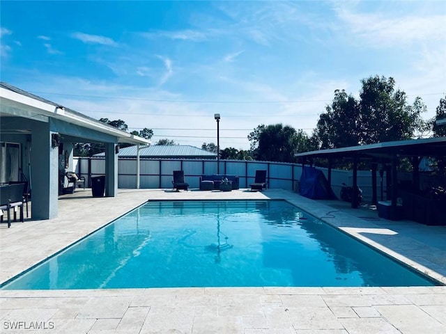 view of swimming pool featuring a gazebo, a patio, and a fenced backyard