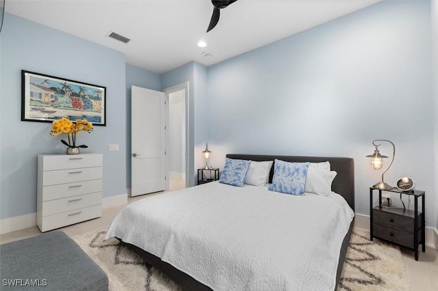 bedroom with visible vents, baseboards, and ceiling fan
