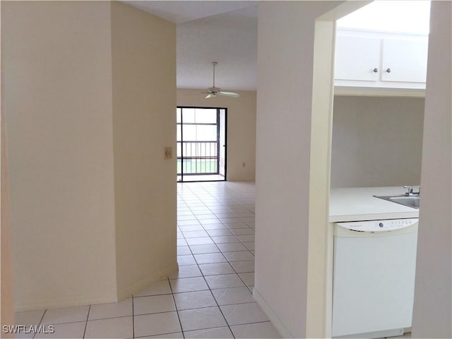 9265 Lake Park Dr Unit 201, Fort Myers, FL 33919 - hallway with baseboards, a sink, and light tile patterned flooring
