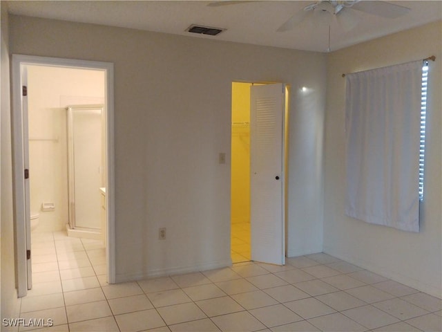 9265 Lake Park Dr Unit 201, Fort Myers, FL 33919 - unfurnished bedroom featuring light tile patterned floors, ensuite bathroom, a closet, and visible vents