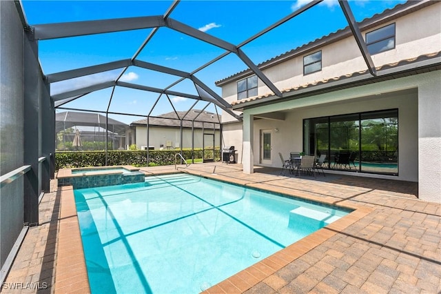 17186 Ashcomb Way, Estero, FL 33928 - view of pool featuring a patio area, a pool with connected hot tub, and a lanai