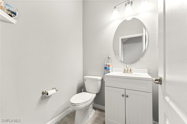 17186 Ashcomb Way, Estero, FL 33928 - half bathroom featuring vanity, toilet, baseboards, and tile patterned flooring