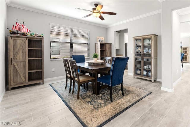 17186 Ashcomb Way, Estero, FL 33928 - dining room with ceiling fan, crown molding, and baseboards