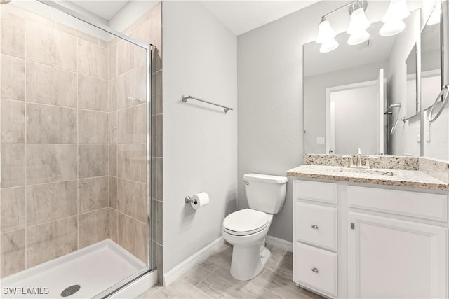 17186 Ashcomb Way, Estero, FL 33928 - full bath with a chandelier, toilet, vanity, a shower stall, and baseboards