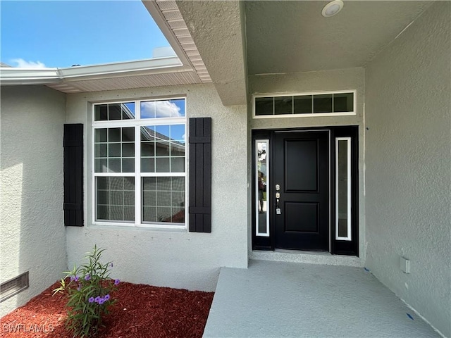 411 Paramaribo St, Punta Gorda, FL 33983 - view of exterior entry featuring stucco siding