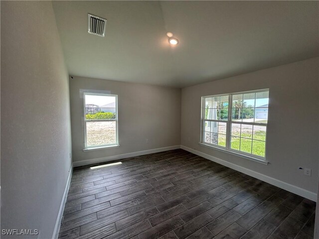 411 Paramaribo St, Punta Gorda, FL 33983 - empty room featuring baseboards and dark wood-style flooring