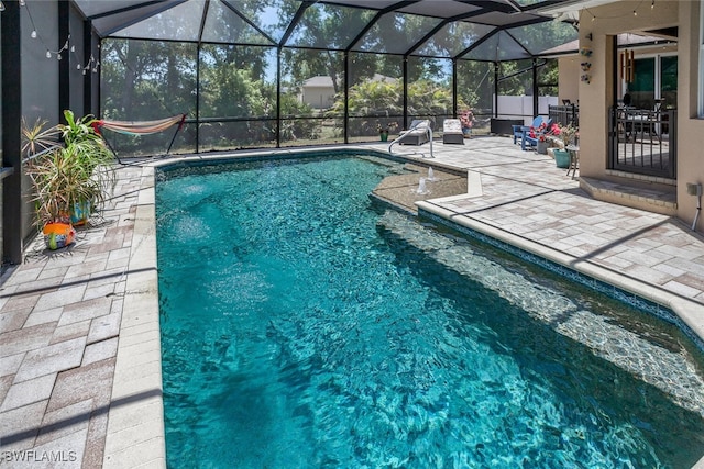 pool with a patio and a lanai