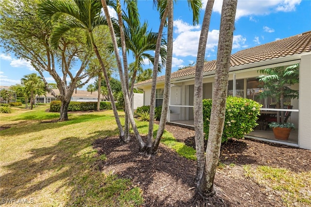 view of yard with a sunroom