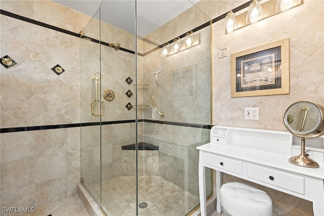 full bathroom with tile walls and a shower stall