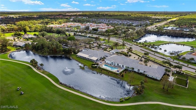 drone / aerial view featuring a residential view and a water view