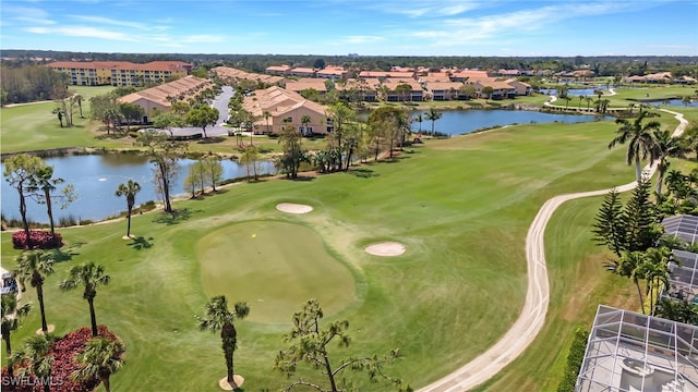birds eye view of property featuring a residential view, a water view, and golf course view