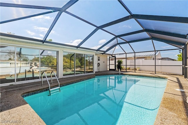 view of swimming pool with glass enclosure