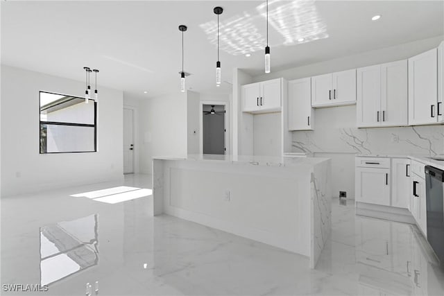 kitchen with marble finish floor, a center island, white cabinets, tasteful backsplash, and hanging light fixtures