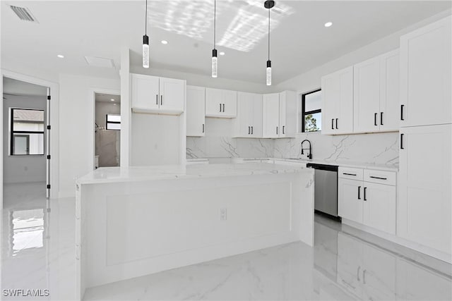 kitchen featuring stainless steel dishwasher, recessed lighting, white cabinets, and tasteful backsplash