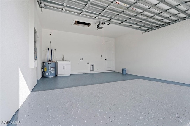 garage with a garage door opener and water heater