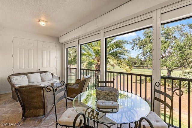 9280 Triana Ter Unit 234, Fort Myers, FL 33912 - sunroom / solarium with healthy amount of natural light, outdoor lounge area, golf course view, and outdoor dining area