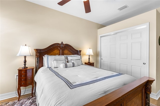 9280 Triana Ter Unit 234, Fort Myers, FL 33912 - bedroom featuring baseboards, a closet, wood finished floors, and ceiling fan