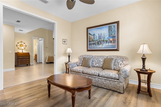 9280 Triana Ter Unit 234, Fort Myers, FL 33912 - living room with a ceiling fan, baseboards, and wood finished floors