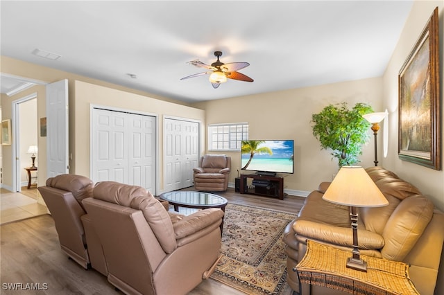 9280 Triana Ter Unit 234, Fort Myers, FL 33912 - living area with a ceiling fan, wood finished floors, and baseboards