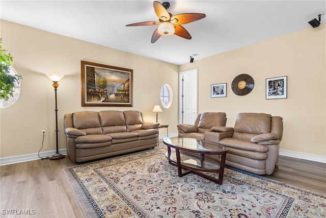 9280 Triana Ter Unit 234, Fort Myers, FL 33912 - living room with a ceiling fan, wood finished floors, and baseboards
