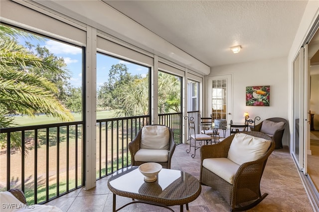 9280 Triana Ter Unit 234, Fort Myers, FL 33912 - sunroom featuring a textured ceiling