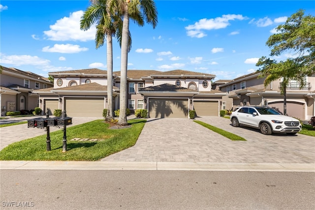 9280 Triana Ter Unit 234, Fort Myers, FL 33912 - view of front of property with decorative driveway and stucco siding