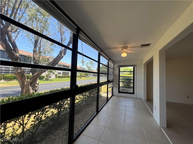 8080 S Woods Cir Unit 11, Fort Myers, FL 33919 - unfurnished sunroom with tile patterned floors, ceiling fan, and visible vents
