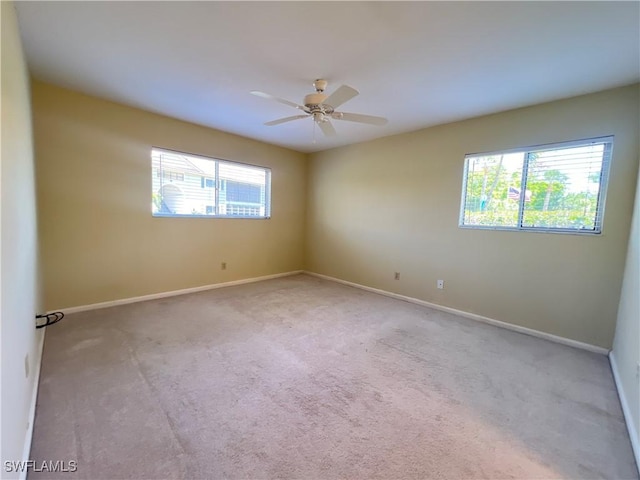 8080 S Woods Cir Unit 11, Fort Myers, FL 33919 - unfurnished room with baseboards, carpet, and a ceiling fan
