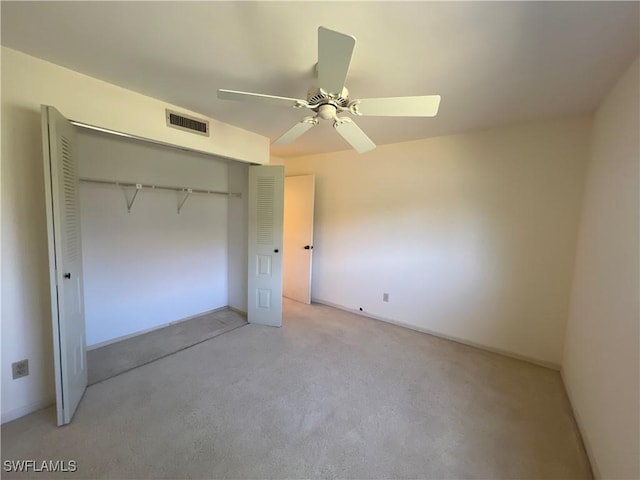 8080 S Woods Cir Unit 11, Fort Myers, FL 33919 - unfurnished bedroom featuring visible vents, a ceiling fan, a closet, and light colored carpet