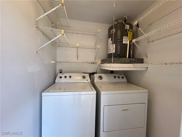 8080 S Woods Cir Unit 11, Fort Myers, FL 33919 - laundry area with laundry area, washing machine and dryer, and water heater