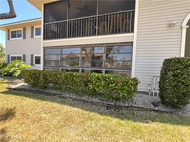 8080 S Woods Cir Unit 11, Fort Myers, FL 33919 - rear view of house featuring a yard