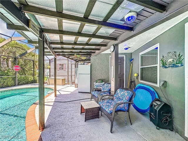view of patio featuring glass enclosure and an outdoor pool