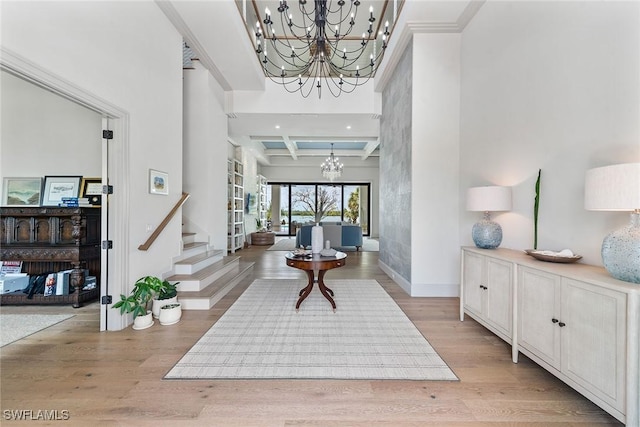 1247 Blue Hill Creek Dr, Marco Island, FL 34145 - foyer featuring a chandelier, coffered ceiling, light wood-type flooring, baseboards, and beam ceiling
