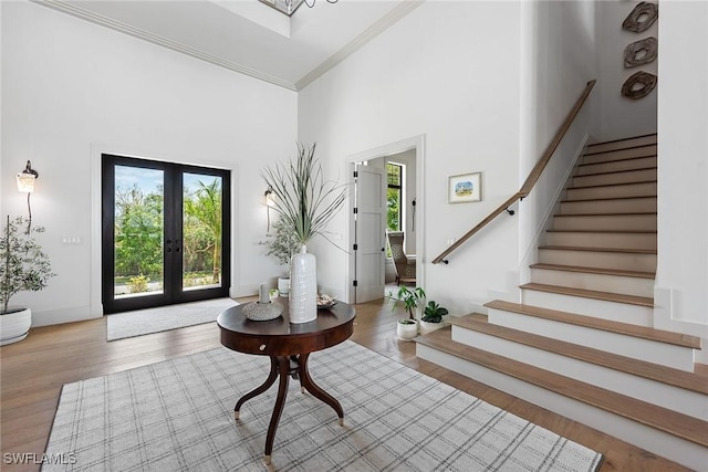 1247 Blue Hill Creek Dr, Marco Island, FL 34145 - foyer with stairs, wood finished floors, ornamental molding, a towering ceiling, and french doors