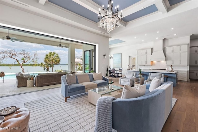 1247 Blue Hill Creek Dr, Marco Island, FL 34145 - living area with a high ceiling, a chandelier, beamed ceiling, recessed lighting, and hardwood / wood-style floors