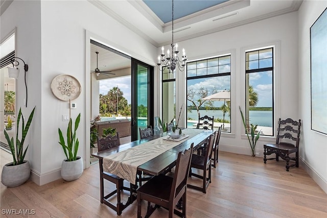 1247 Blue Hill Creek Dr, Marco Island, FL 34145 - dining area featuring light wood-style flooring, ornamental molding, a chandelier, and baseboards