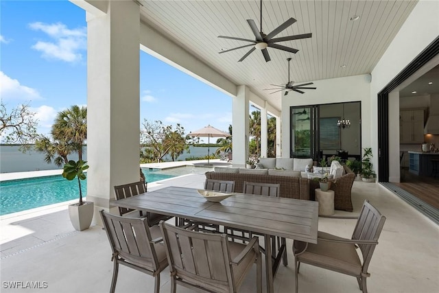 1247 Blue Hill Creek Dr, Marco Island, FL 34145 - view of patio with an outdoor living space, a ceiling fan, an outdoor pool, and outdoor dining area