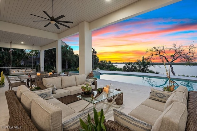 1247 Blue Hill Creek Dr, Marco Island, FL 34145 - view of patio featuring an outdoor living space, a water view, an outdoor pool, and a ceiling fan