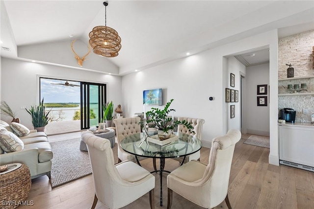 1247 Blue Hill Creek Dr, Marco Island, FL 34145 - dining space with light wood-type flooring and lofted ceiling