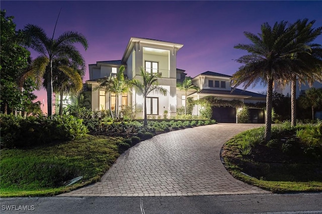 1247 Blue Hill Creek Dr, Marco Island, FL 34145 - view of front of house featuring stucco siding, curved driveway, and a balcony