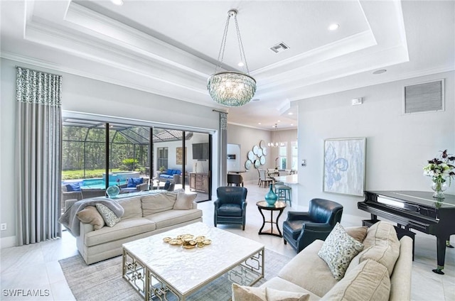 living area with crown molding, a raised ceiling, and a notable chandelier