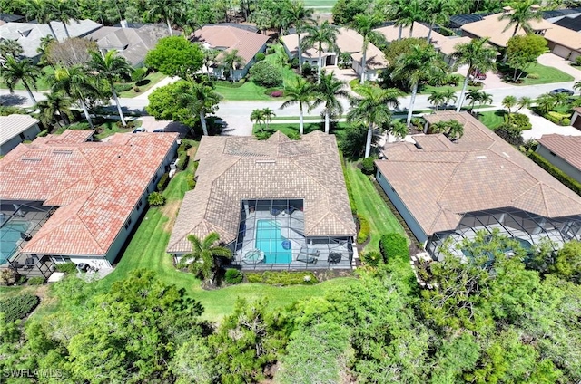 birds eye view of property with a residential view