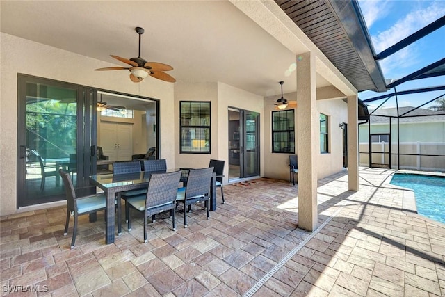 view of patio featuring a ceiling fan, an outdoor pool, a lanai, and outdoor dining space