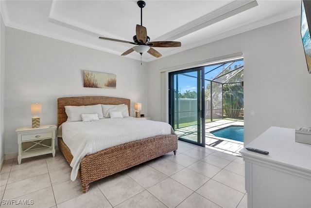 bedroom featuring a sunroom, access to exterior, a raised ceiling, light tile patterned floors, and a ceiling fan