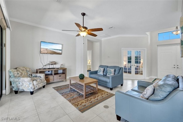 living area featuring crown molding, light tile patterned floors, a ceiling fan, and french doors